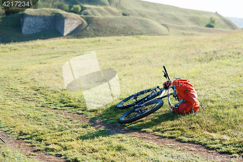 Image of Bicycle with orange bags for travel