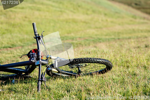 Image of Bicycle with orange bags for travel