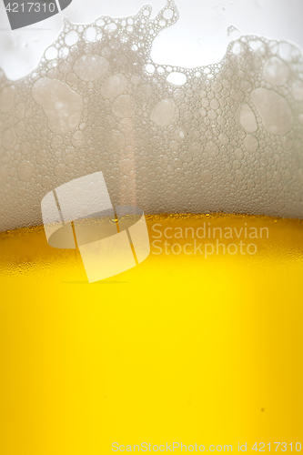 Image of Glass of cold, foamy drink