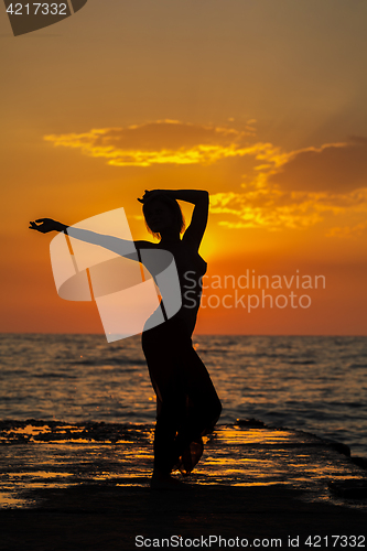 Image of girl at sunset