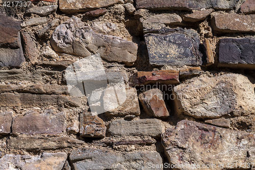 Image of part of a stone wall, for background or texture.