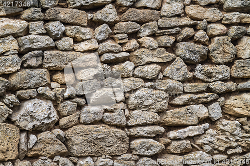 Image of part of a stone wall, for background or texture.