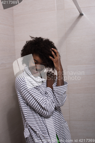 Image of beautiful black woman wearing  bathrobe