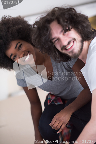 Image of multiethnic couple renovating their home