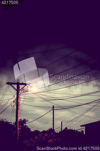 Image of Street light at night with a stormy sky background