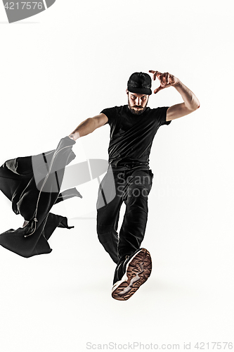 Image of The silhouette of one hip hop male break dancer dancing on white background