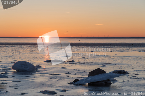 Image of Sunset view by an icy coast