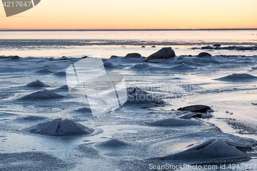 Image of Sunset view at an ice covered coastline