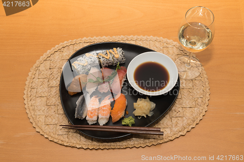 Image of Sushi meal with white wine