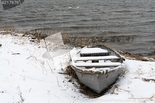 Image of Snowy vintage rowing boat