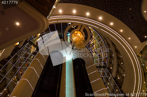 Image of Respectable and shining interior design with elevators in luxuri