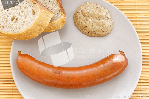 Image of tasty sausages with bread and mustard