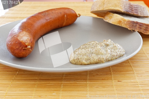 Image of tasty sausages with bread and mustard