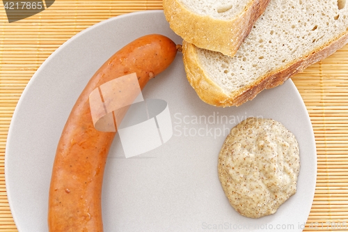 Image of tasty sausages with bread and mustard