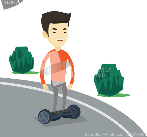 Image of Man riding on self-balancing electric scooter.