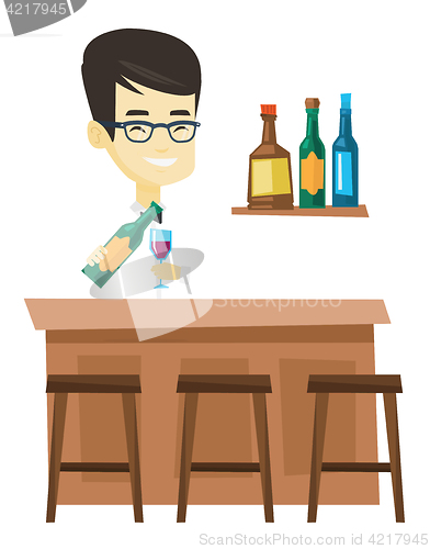 Image of Bartender standing at the bar counter.