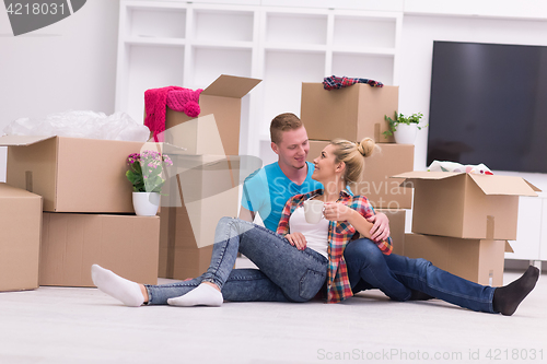 Image of young couple moving  in new house