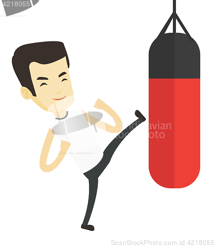 Image of Man exercising with punching bag.