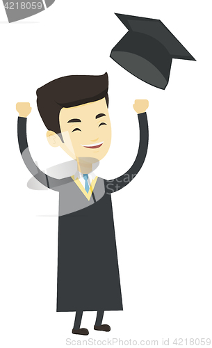 Image of Graduate throwing up graduation hat.