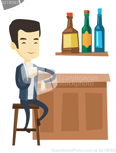 Image of Smiling man sitting at the bar counter.
