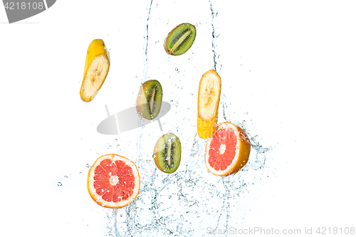 Image of Fresh fruits falling in water splash, isolated on white background