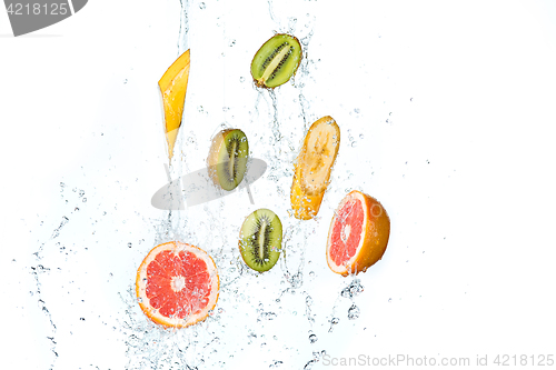 Image of Fresh fruits falling in water splash, isolated on white background