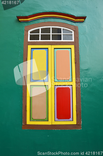 Image of Colorful window a colonial house