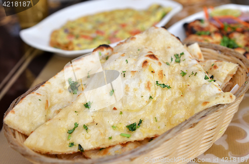 Image of Garlic and coriander naan on a basket