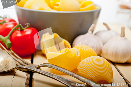 Image of Italian snail lumaconi pasta with tomatoes