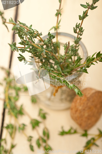 Image of fresh thyme on a glass jar