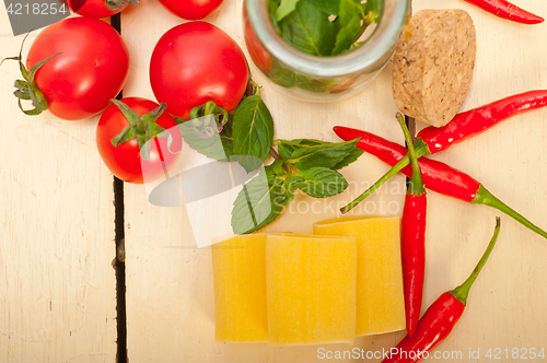 Image of Italian pasta paccheri with tomato mint and chili pepper