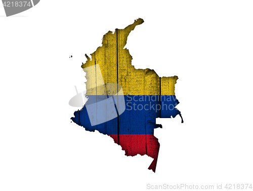 Image of Map and flag of Colombia on weathered wood