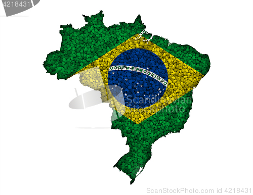 Image of Map and flag of Brazil on poppy seeds