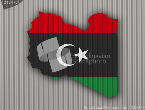 Image of Map and flag of Libya on corrugated iron