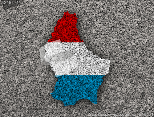 Image of Map and flag of Luxembourg on poppy seeds