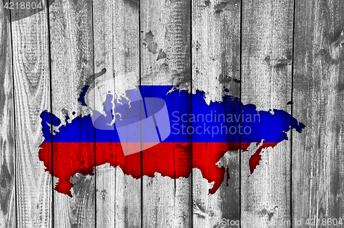Image of Map and flag of Russia on weathered wood
