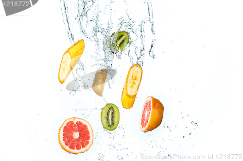 Image of Fresh fruits falling in water splash, isolated on white background