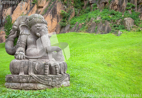 Image of Ganesha statue in a beautiful mountain garden