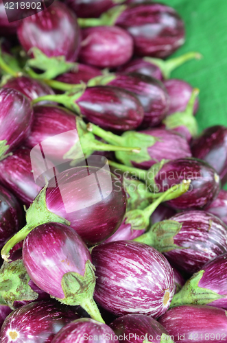 Image of Fresh eggplants for sale in a market