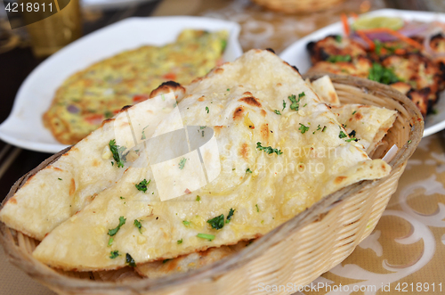 Image of Garlic and coriander naan on a basket