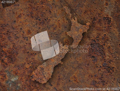 Image of Map of New Zealand on rusty metal,