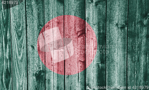 Image of Flag of Bangladesh on weathered wood