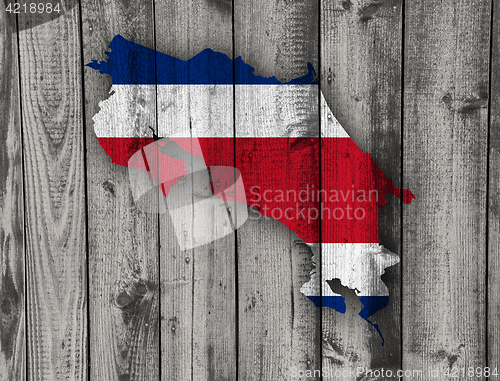 Image of Map and flag of Costa Rica on weathered wood