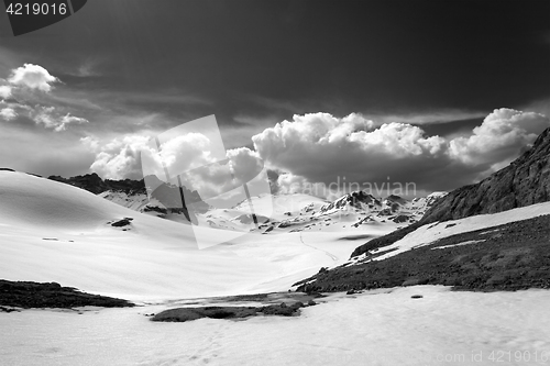 Image of Black and white view on snow plateau with footpath