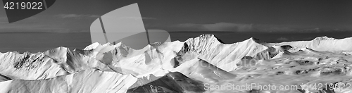 Image of Black and white panoramic view on off-piste slope and snowy plat