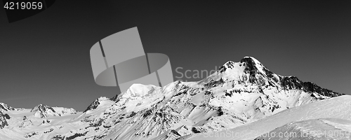 Image of Panoramic view on off-piste slope and mount Kazbek at sun winter