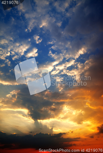 Image of Multicolor sunset sky with clouds and sun rays