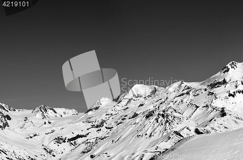 Image of Black and white panoramic view on off-piste slope and snow mount