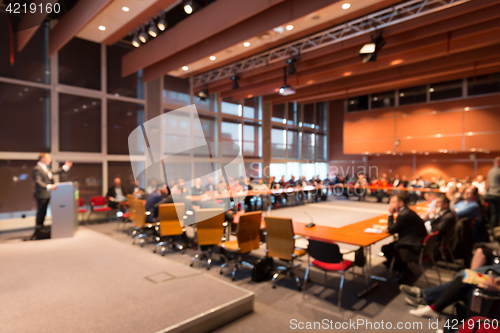 Image of Public speaker giving talk at Business Event.