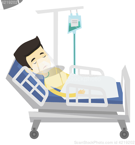 Image of Patient lying in hospital bed with oxygen mask.